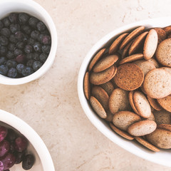 Brunch appetizers laying on a white granite counter top with warm natural light filtering in