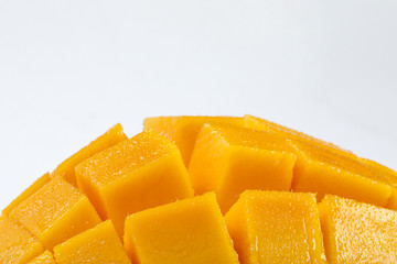 ripe yellow mango cut slice whole on white background