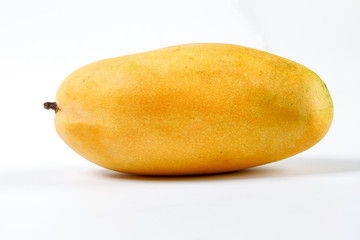 ripe yellow mango cut slice whole on white background