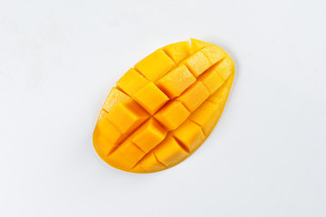ripe yellow mango cut slice whole on white background