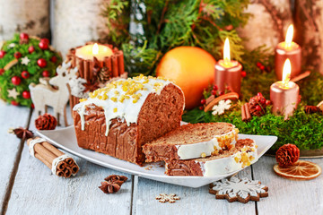 Fototapeta na wymiar Christmas gingerbread cake among traditional decorations.