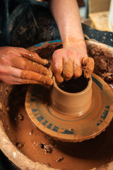 Potter at work. Workshop.
