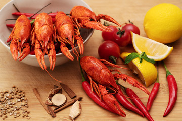 Crayfish or baby Lobster. Red boiled crawfishes on a wooden