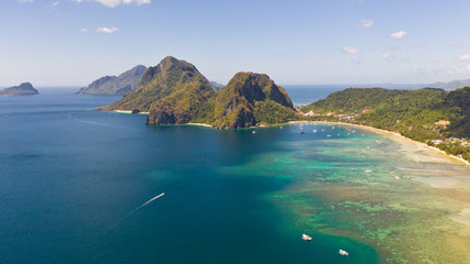 Seacoast with lagoon and islands. Nature and settlements of the Philippines.El Nido aerial view.