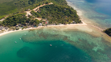 Seacoast with lagoon and islands. Nature and settlements of the Philippines.El Nido aerial view.