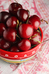 A bowl with ripe cherry