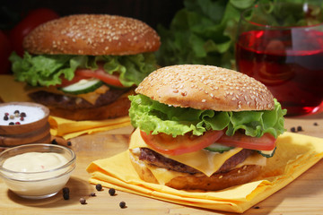 Two fresh hamburgers with vegetables