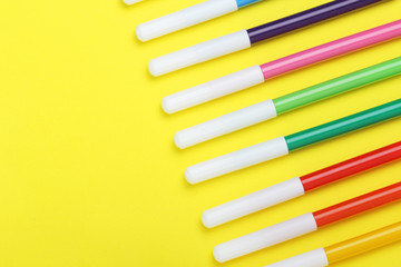 Multicolored markers at bright background	