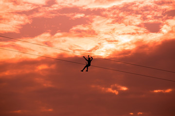 Activity of human at adventure park,The young is hung a hose on sky