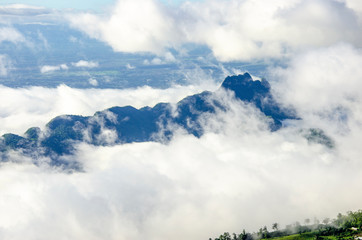 White clouds covered the mountains in the morning with a blurred pattern background