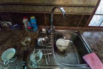 huge heap of dirty dishes waiting for the flatmate