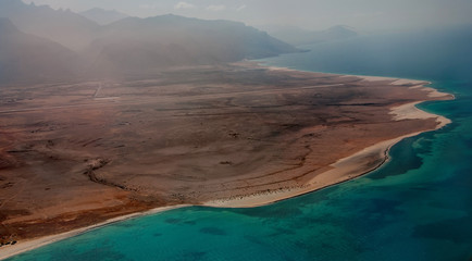 The view from the airplane window on the coast of the amazing island of Socotra in the ocean.