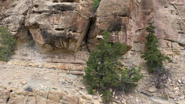Rotating aerial view of grainery made from Fremont Indians in Utah through Nine Mile Canyon.