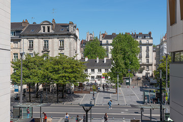 Wooded square in the city center around the tram lines