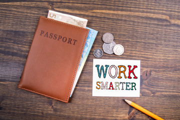 Work smarter. Euro money and British coins with passport. Travel concept, wooden background