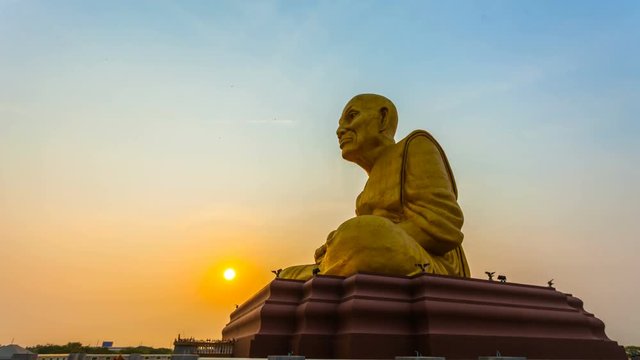 timelapse sunrise at the big golden Luang Pu Tuad