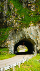 Road with old tunnel in mountains Norway