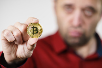 Man having bitcoin coin