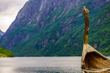 Obraz premium Old viking boat on fjord shore, Norway