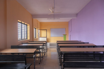 Empty class room and desks with colorful walls