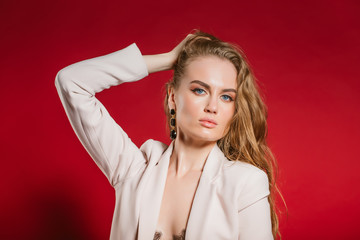 portrait of a young sexy woman on red background