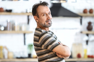 Handsome mature man in kitchen