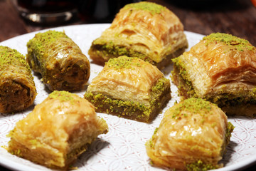 Middle eastern or arabic dishes. Turkish Dessert Baklava with pistachio on dishes