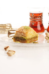 Middle eastern or arabic dishes. Turkish Dessert Baklava with pistachio on dishes