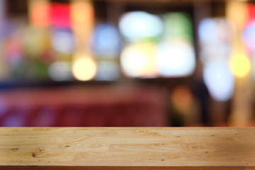 Empty dark wooden table in front of abstract blurred bokeh background of restaurant . can be used for display or montage your products.Mock up for space.