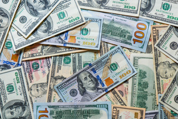 a lot of different dollar bills. Dollars background