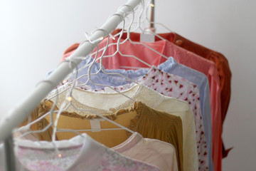 Fototapeta na wymiar Colorful vintage wardrobe on a clothes rack. Selective focus.