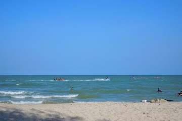 Fototapeta na wymiar PRACHUAP KHIRI KHAN, THAILAND - APRIL 20, 2019 : People playing the sea at cha am beach, Many tourists visit here, View for seascape, Space for text in template