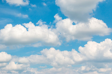 Naklejka na ściany i meble white clouds against blue sky as background