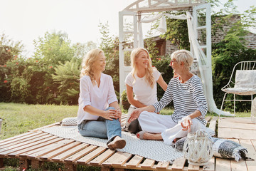 Three happy women smiling, togetherness 