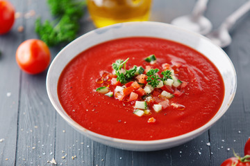 Tasty summer tomato soup served in bowl