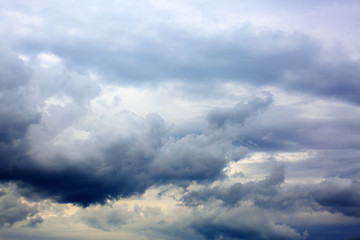 Gray rainy sky with big clouds. Nature background.