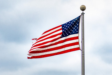 American Flag on a cloudy sky background; Close Up for Memorial Day or 4th of July