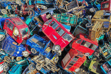 Old motor vehicles piled up waiting to be dismantled and eliminated