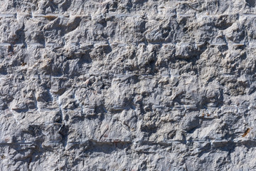 Old  wall of sandstone blocks of different size as background
