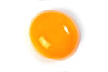 Raw egg yolk on a white background. Close-up. View from above. Protein - obrazy, fototapety, plakaty
