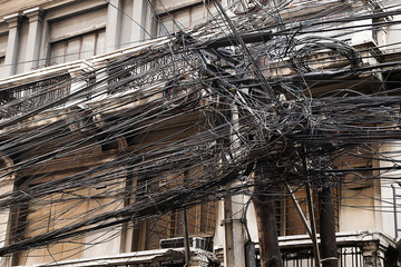 Tangled messy wiring on the streets of Asia