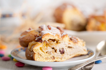 Easter cake with nuts and dry fruits on white wooden background