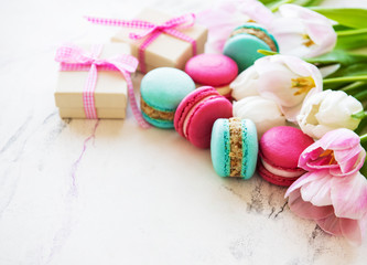 Colorful macaroons and tulips