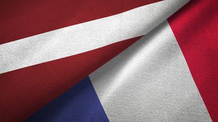 Fototapeta na wymiar Latvia and France two flags textile cloth, fabric texture