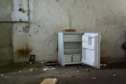 Old Broken Fridge Opeedn In An Abandoned Building