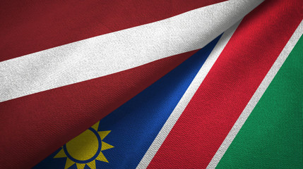 Latvia and Namibia two flags textile cloth, fabric texture