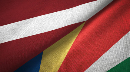 Fototapeta premium Latvia and Seychelles two flags textile cloth, fabric texture