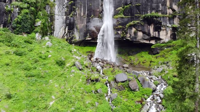 4k aerial dolly in at waterfall in the north of India