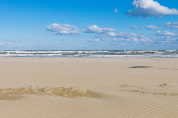 Fototapeta na wymiar Sea view from a beach with cloudy sky, Summertime at the beach