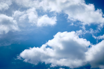 Obraz premium Beautiful bright and blue springtime sky with white clouds above Germany